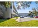 Exterior view of the building with parking, walkways, and second-story apartments at 2441 Persian Dr # 53, Clearwater, FL 33763