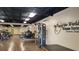 Bright fitness center with modern equipment and dark wood-look floors in a Clearwater, Florida community at 2441 Persian Dr # 53, Clearwater, FL 33763