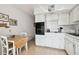 Well-lit kitchen with table, oven, and countertop space at 2441 Persian Dr # 53, Clearwater, FL 33763