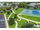 Overhead view of park featuring picnic tables, walking paths, and tennis court at 2441 Persian Dr # 53, Clearwater, FL 33763