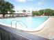 Outdoor swimming pool with clear blue water and lounge chairs, perfect for relaxation and enjoying the sunshine at 2441 Persian Dr # 53, Clearwater, FL 33763