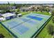 Aerial view of a well-maintained tennis court facility at 2441 Persian Dr # 53, Clearwater, FL 33763