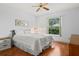 Bedroom with wood floors and window at 2517 Lynx Rd # 20, Sun City Center, FL 33573