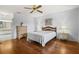 Bright bedroom with wood floors and ceiling fan at 2517 Lynx Rd # 20, Sun City Center, FL 33573