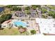 Aerial view of community pool, lounge chairs, and gazebo at 2517 Lynx Rd # 20, Sun City Center, FL 33573