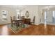 Traditional dining room featuring hardwood floors and a chandelier at 2517 Lynx Rd # 20, Sun City Center, FL 33573