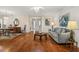 Bright living room with hardwood floors, neutral walls, and comfy seating at 2517 Lynx Rd # 20, Sun City Center, FL 33573