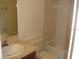 Bathroom featuring a vanity with sink, toilet, and tiled shower and tub combo at 2567 Bentley Dr, Palm Harbor, FL 34684