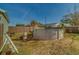 Backyard featuring an above-ground pool, a wooden fence, and green grass with a blue sky above at 2749 16Th N Ave, St Petersburg, FL 33713