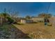 Backyard featuring an above-ground pool, a wooden fence, and green grass with a blue sky above at 2749 16Th N Ave, St Petersburg, FL 33713