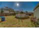 Backyard featuring an above-ground pool, a wooden fence, and green grass with a blue sky above at 2749 16Th N Ave, St Petersburg, FL 33713