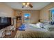 This lovely bedroom is bathed in sunlight and features a ceiling fan and comfortable furnishings at 2749 16Th N Ave, St Petersburg, FL 33713