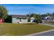 Charming home with a well-manicured front lawn featuring green paint and a red door from a high angle at 2749 16Th N Ave, St Petersburg, FL 33713