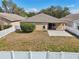 Backyard with paver patio offers a peaceful retreat with privacy fencing and lush surroundings at 2811 Butterfly Landing Dr, Land O Lakes, FL 34638