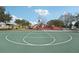 Community basketball court with playground nearby offers recreational opportunities for all ages at 2811 Butterfly Landing Dr, Land O Lakes, FL 34638