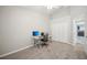 Neutral bedroom featuring a ceiling fan, closet, and an office setup with a computer at 2811 Butterfly Landing Dr, Land O Lakes, FL 34638