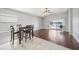 The hardwood floors in the dining area compliment the sliding glass doors with lake view at 2811 Butterfly Landing Dr, Land O Lakes, FL 34638