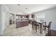 Bright kitchen with granite countertops, stainless appliances, and a functional breakfast bar area at 2811 Butterfly Landing Dr, Land O Lakes, FL 34638