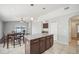 Kitchen island, stainless steel appliances, and eat in dining space at 2811 Butterfly Landing Dr, Land O Lakes, FL 34638