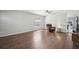 Inviting living room featuring wood floors and large windows that bring in plenty of sunlight at 2811 Butterfly Landing Dr, Land O Lakes, FL 34638