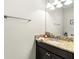 Bathroom featuring granite countertop, modern sink and stainless steel fixtures at 28635 Tranquil Lake Cir, Wesley Chapel, FL 33543