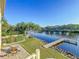 Beautiful backyard featuring a patio with a firepit and waterfront access with a dock at 2902 N Shoreview Pl, Tampa, FL 33602