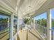 Outdoor balcony features views of the lake, white railing, and seating for relaxing at 2902 N Shoreview Pl, Tampa, FL 33602