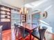 Dining room featuring custom cabinetry, wood floors, and modern chandelier at 2902 N Shoreview Pl, Tampa, FL 33602