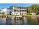 Waterfront home features multi-level balconies and a private dock, ideal for enjoying scenic river views at 2902 N Shoreview Pl, Tampa, FL 33602