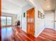 Spacious living room with hardwood floors, natural light, and french doors to a porch at 2902 N Shoreview Pl, Tampa, FL 33602