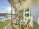 View of the screened porch with patio furniture overlooking the lake at 2902 N Shoreview Pl, Tampa, FL 33602