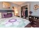 Cozy bedroom with a queen-size bed, closet and hardwood floors at 300 Glennes Ln # 208, Dunedin, FL 34698