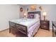 Bedroom with a queen-size bed, side tables, and modern decor at 300 Glennes Ln # 208, Dunedin, FL 34698