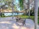 A quaint courtyard with bench seating provides a peaceful spot to relax and enjoy the community's outdoor setting at 300 Glennes Ln # 208, Dunedin, FL 34698