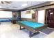 The game room provides recreational opportunities with well-maintained pool tables and ample space for friendly competition at 300 Glennes Ln # 208, Dunedin, FL 34698