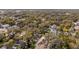 Aerial view of the neighborhood showcasing lush trees and well-maintained homes in a residential area at 321 W Wilder Ave, Tampa, FL 33603