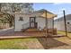 Inviting wooden deck with seating and sunshade, offering a perfect spot for relaxation and entertaining outdoors at 321 W Wilder Ave, Tampa, FL 33603