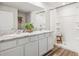 Bathroom with double sink marble vanity, large mirror and shower-tub combination at 4010 112Th E St, Palmetto, FL 34221