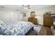 Bedroom with wood floors, ceiling fan and ensuite access at 4043 93Rd N Ter, Pinellas Park, FL 33782