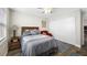 Cozy bedroom featuring a comfortable bed and a wood floor at 4043 93Rd N Ter, Pinellas Park, FL 33782