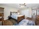 Bedroom with wood floors, ceiling fan and ensuite access at 4043 93Rd N Ter, Pinellas Park, FL 33782