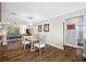 Dining room with hardwood floors and a view of the living room at 4043 93Rd N Ter, Pinellas Park, FL 33782