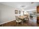 Light and airy dining room with hardwood floors and a wood table at 4043 93Rd N Ter, Pinellas Park, FL 33782