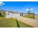 White single story home with a two-car garage and lush lawn at 4043 93Rd N Ter, Pinellas Park, FL 33782