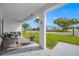 Covered porch with wicker furniture, offering a relaxing outdoor space at 4043 93Rd N Ter, Pinellas Park, FL 33782