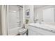 Well-lit bathroom with a shower over tub, marble countertops, and sleek fixtures for a modern and clean aesthetic at 4107 112Th E St, Palmetto, FL 34221