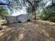 Shows an expansive grassy backyard with visible utilities, including an air conditioner at 4208 N 31St St, Tampa, FL 33610