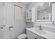 Updated bathroom featuring a vanity, glass shower, updated fixtures and light at 4414 W Paris St, Tampa, FL 33614