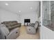 Cozy living room featuring plush seating, neutral walls, and natural light filtering through the windows at 4414 W Paris St, Tampa, FL 33614