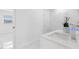 Modern bathroom with tiled shower, vanity and sleek fixtures at 4716 Eldorado Dr, Tampa, FL 33615